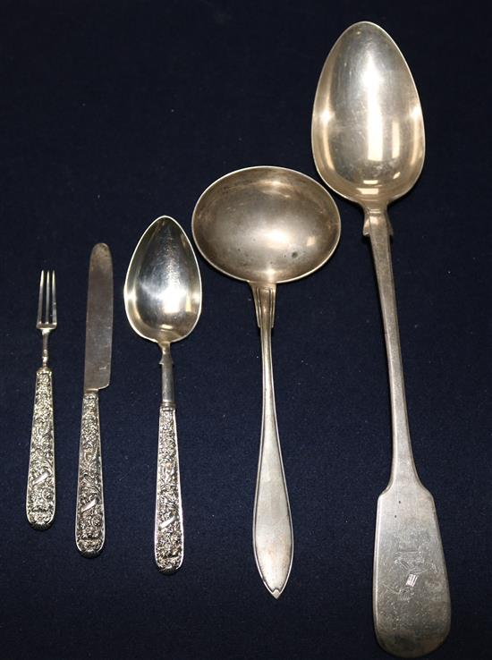 A George IV silver christening trio, a Victorian silver basting spoon and a Swedish silver sauce ladle.